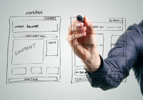 designer drawing website development wireframe