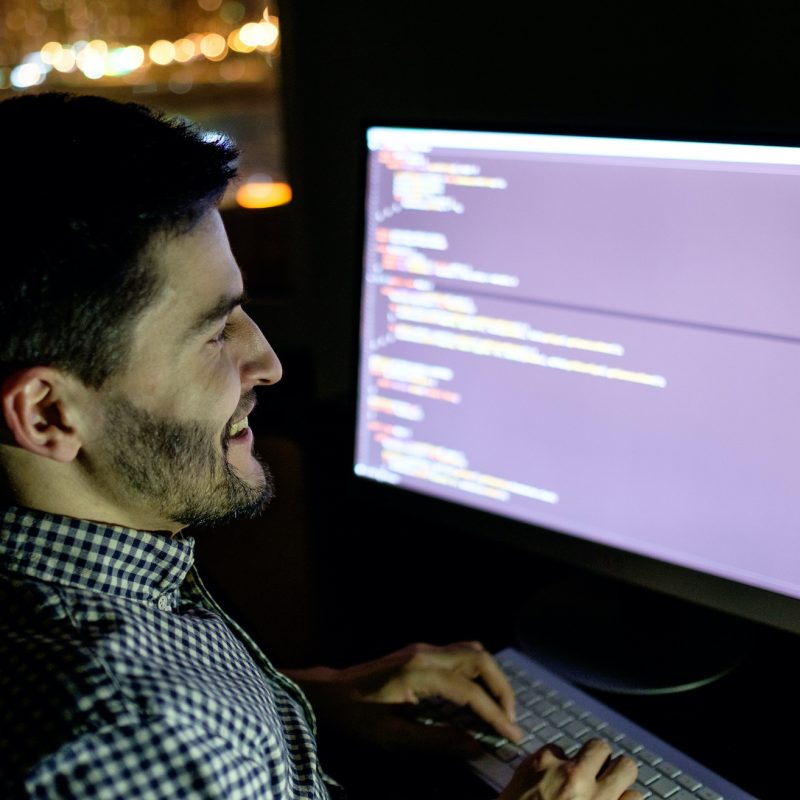 Software developer computer at dark home office. Startup and hard working concept