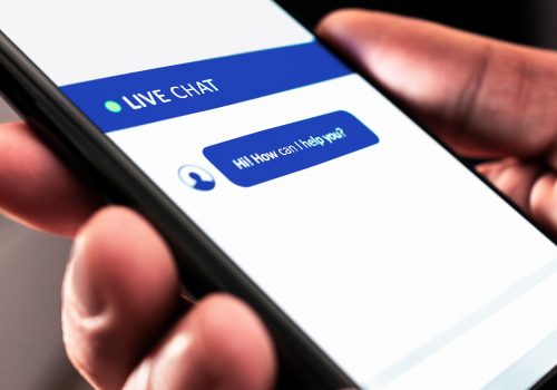 Live customer chat or chatbot service. Support bot for online help on website. Automated message in mobile phone. Assistant and communication app on cell screen. Digital care or feedback for business.