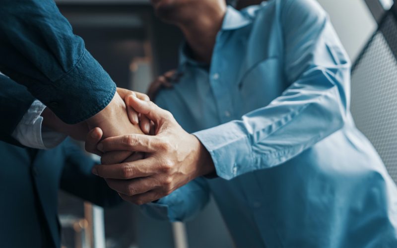 Business shaking hands, finishing up meeting. Successful businessmen handshaking after good deal.