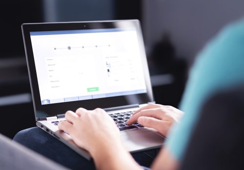 Personal information to shop online. Filling electronic form on internet with laptop. Digital customer info on website. Man buying a service or ordering a product. Web data protection in e commerce.