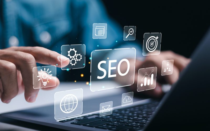 Businessman use laptop to analyze SEO search engine optimization for promoting ranking traffic on website and optimizing your website to rank in search engines.